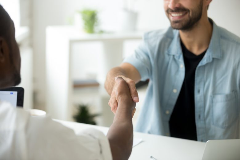 Multiracial Businessmen Shaking Hands, Multi Ethnic Partnership